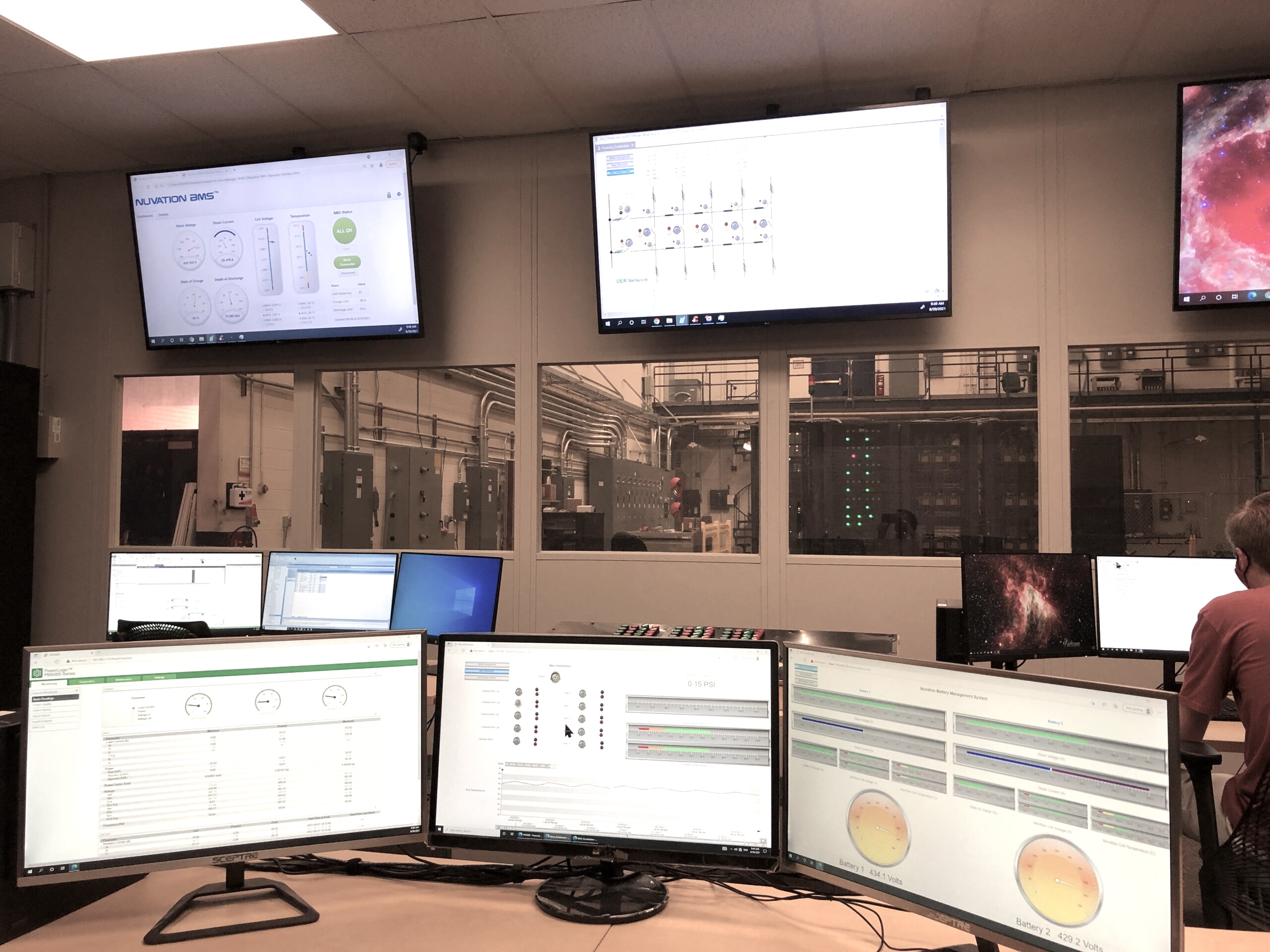 SCADA control room with battery management and power monitoring displays